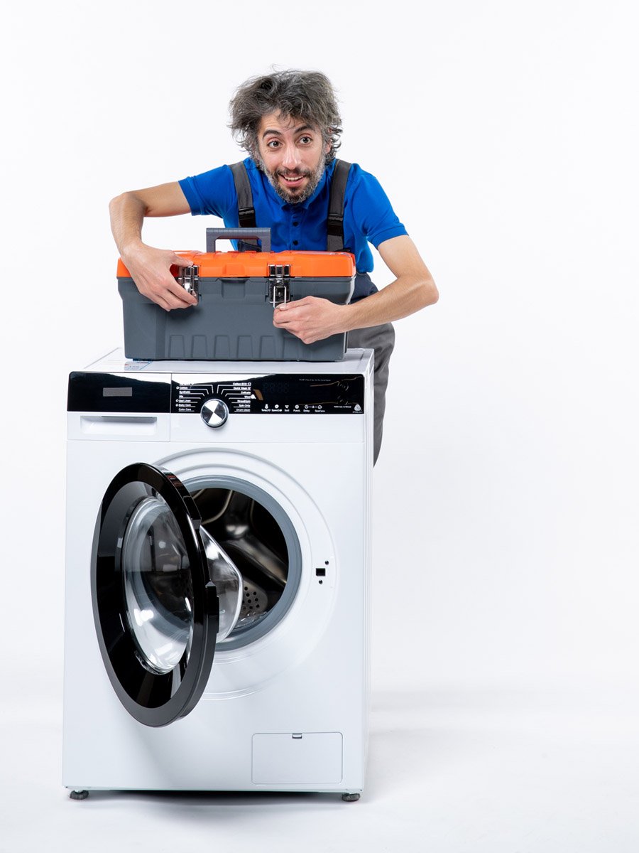 front view handsome repairman closing tools bag washing machine white space